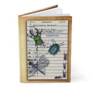 Heid Pitre writing journal with an old library borrowers card on the cover of Bugs for book lovers and librarians.