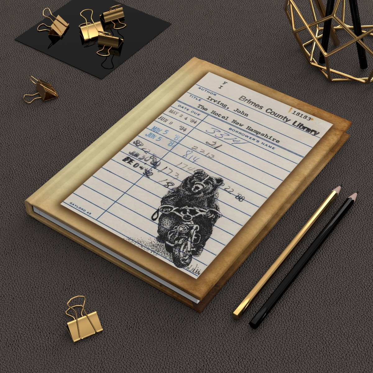 Heid Pitre writing journal with an old library borrowers card on the cover of Hotel New Hampshire for book lovers and librarians.