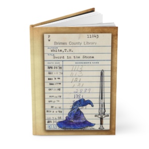 Heid Pitre writing journal with an old library borrowers card on the cover of the sword in the stone for book lovers and librarians.