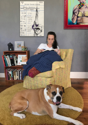 Heidi Pitre pen and ink and watercolor drawing of an aerialist on an oversized canvas print on a library borrower card.